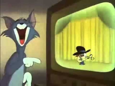 Tom, le chat, éclate de rire devant une représentation du grand père de Jerry, en chanteur de Country Music
